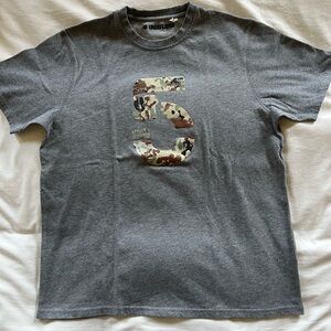 Undefeated Gray Short Sleeve Tee with Skateboarding Graphic